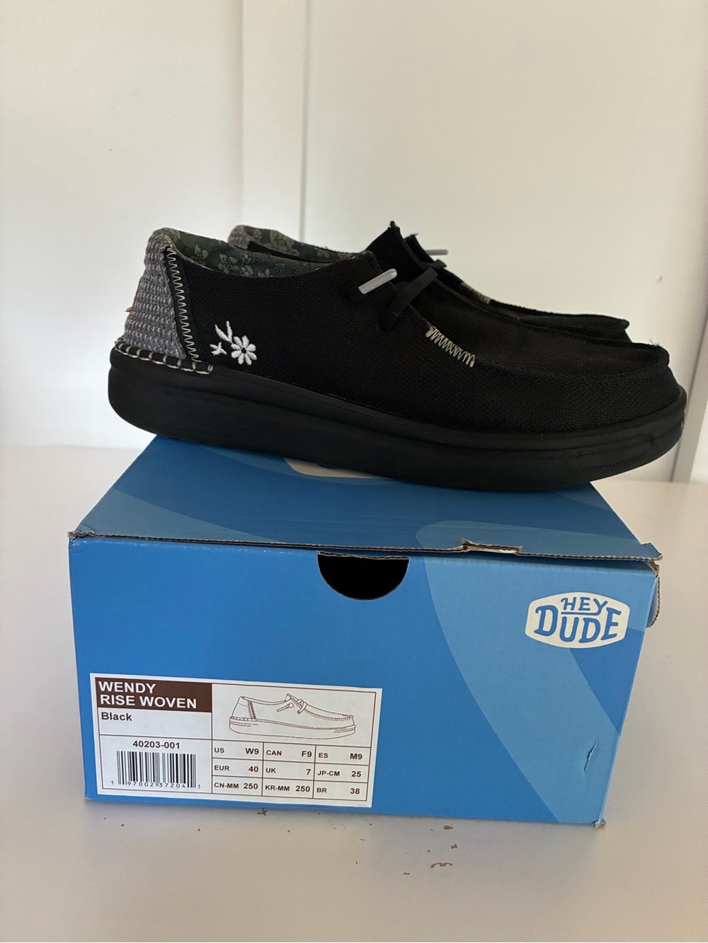 Hey Dude Wendy Rise Woven Black Slip-On Shoes with White Floral Accent